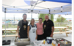 André Fortin, Lucie Schryer, Myriam Laflamme and Patrick Doyon at the corn roast fundraiser on Sunday, August 23. Photo: Jude Osmond